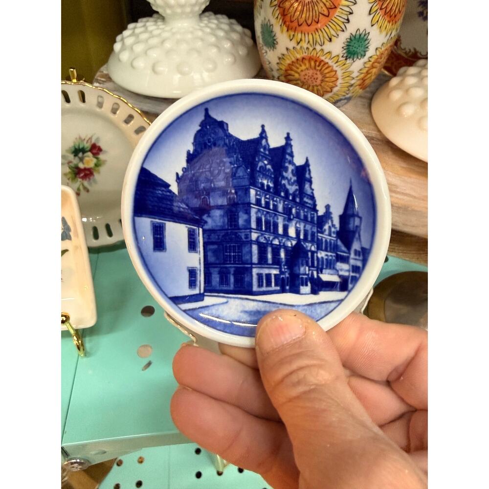 A Royal Copenhagen blue and white transfer-printed ceramic butter pat